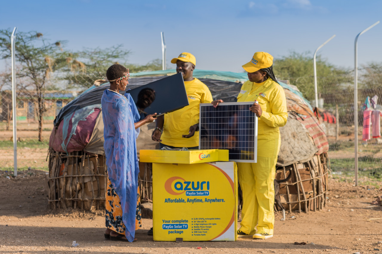Azuri employees selling solar-powered home systems in sub-Saharan Africa