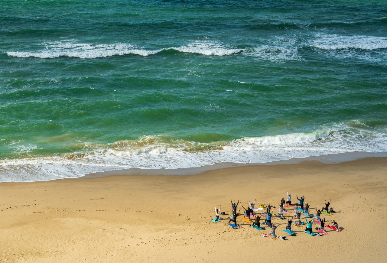 health and wellbeing. Yoga on Bournemouth beach, UK